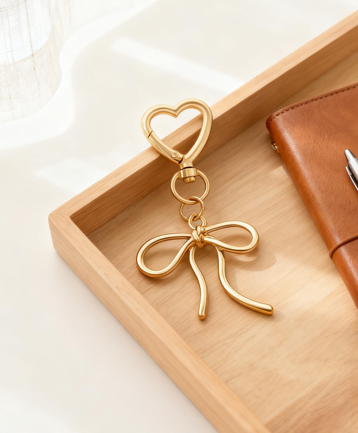 Rikhiua Lindo llavero de lazo elegante con dije de corazón para muj...