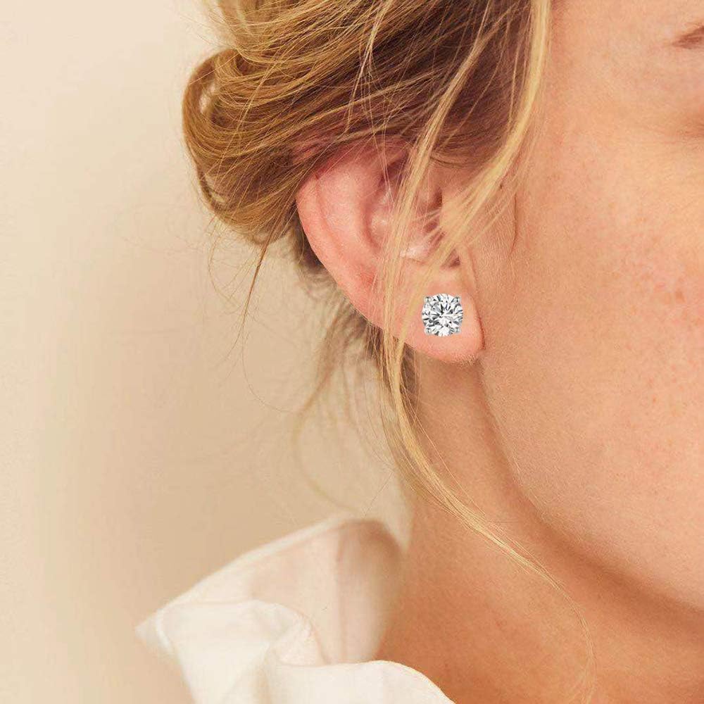 Aretes tipo dormilona chapados en oro blanco de 18 quilates con cir...