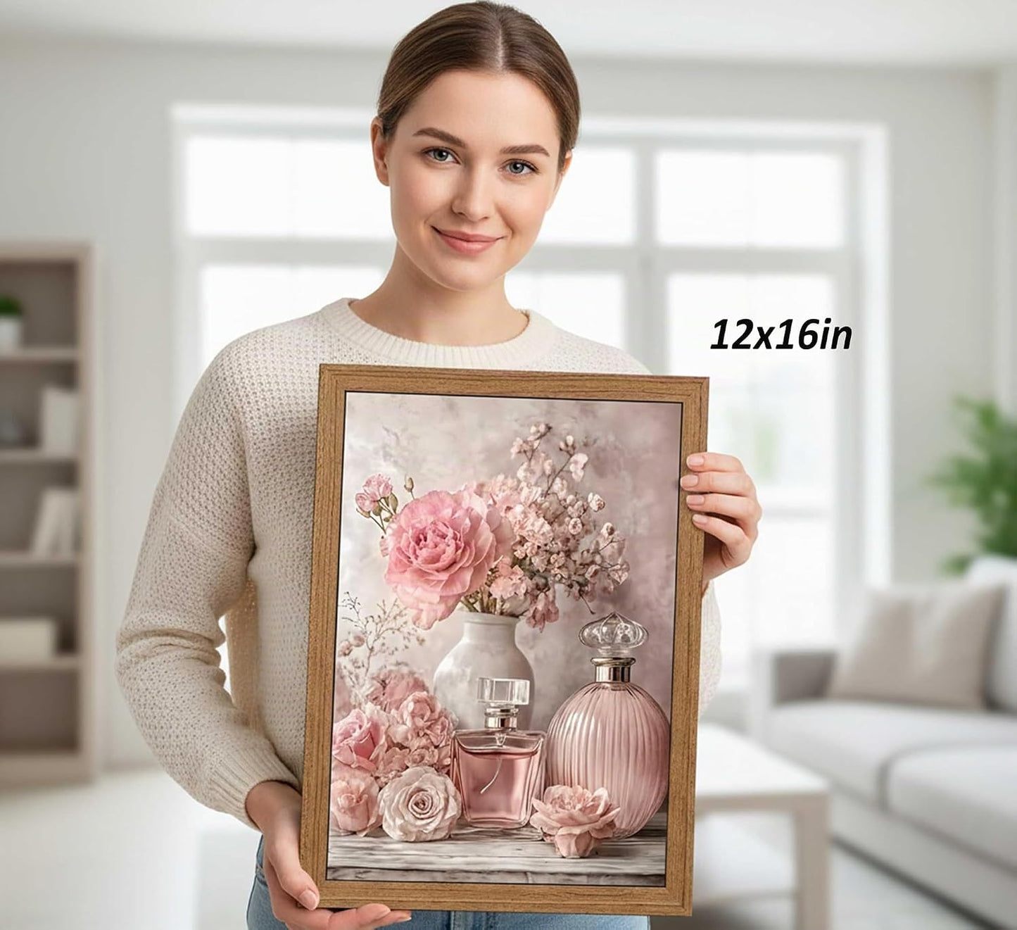 Arte de pared enmarcado de flores rosas, botella de perfume floral...