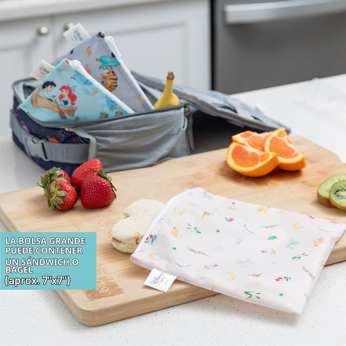 Bumkins Disney Babero Delantal con Volantes y Paquete de 3 Bolsas p...