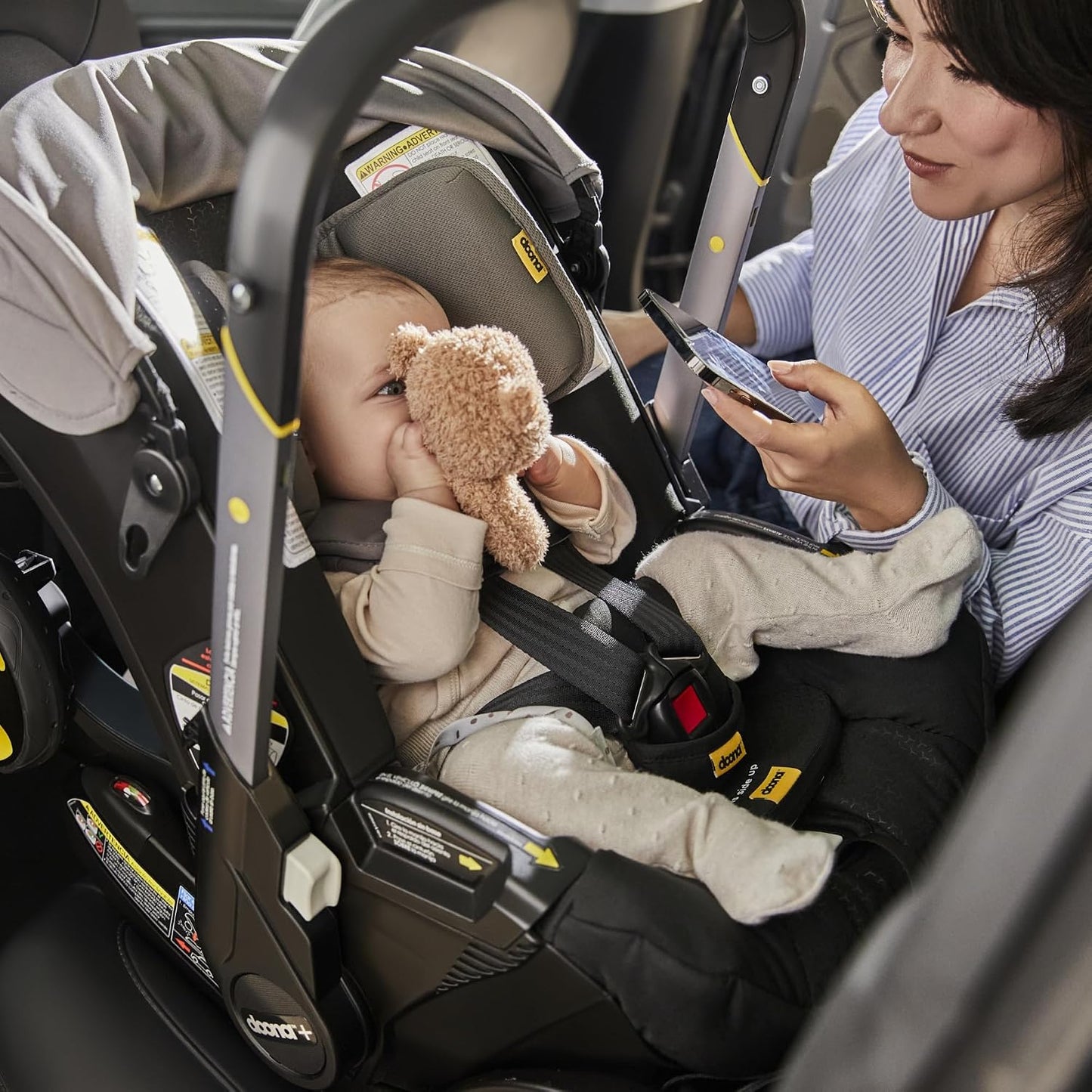 Doona Asiento de coche y cochecito, negro + alerta de asiento infan...